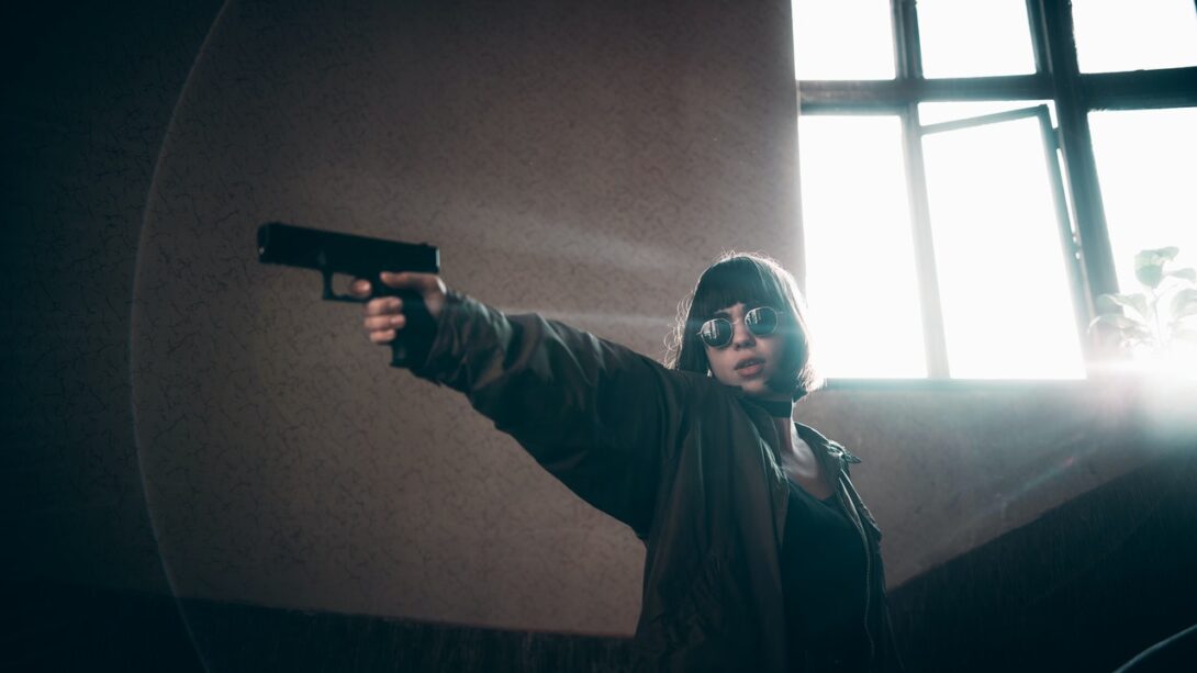 A lady assassin holding a gun